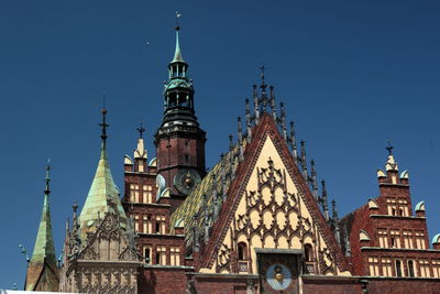 Low angle view of wroclaw town hall against clear sky