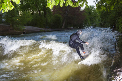 Man surfing in river