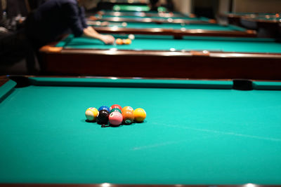 Man playing with ball on table