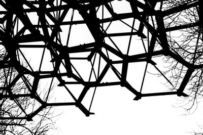 Low angle view of bare tree against sky