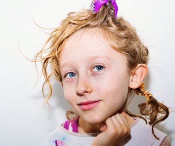 Portrait of girl against white background