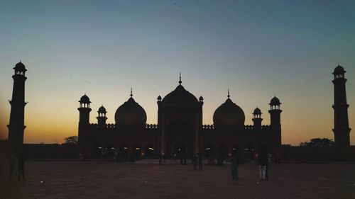 Low angle view of mosque against clear sky