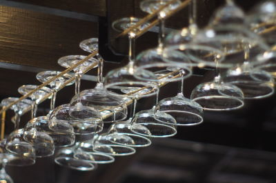 Wineglasses hanging in bar