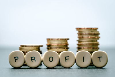 Close-up of coins over white background