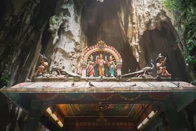 Statue of temple outside building