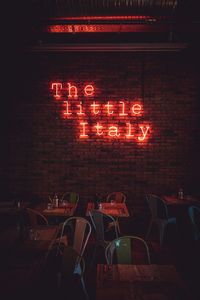 Illuminated text on table at night