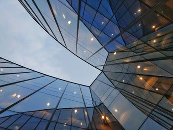 Low angle view of illuminated modern building