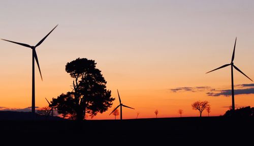 Silhouette trees against sky during sunset