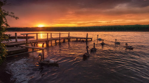 Scenic view of lake against sky during sunset