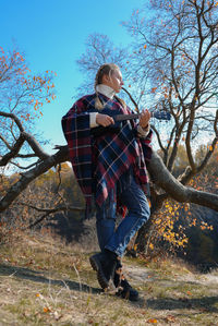 Full length of woman standing on field