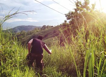 Rear view of man on field