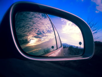 Reflection of car on side-view mirror