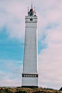 Low angle view of lighthouse against cloudy sky