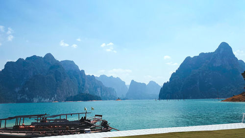 Panoramic view of sea and mountains against sky