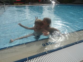 High angle view of boy swimming in pool