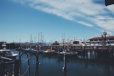 Boats moored at harbor