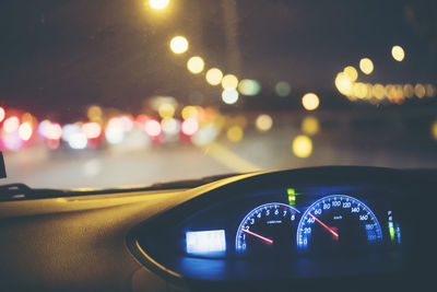 Close-up of illuminated dashboard of car at night