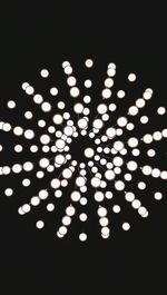 Low angle view of illuminated lights at night