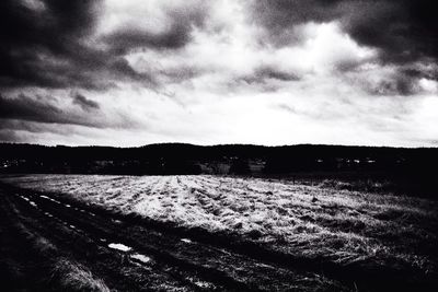 Scenic view of landscape against cloudy sky