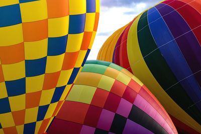 Low angle view of multi colored hot air balloon against sky