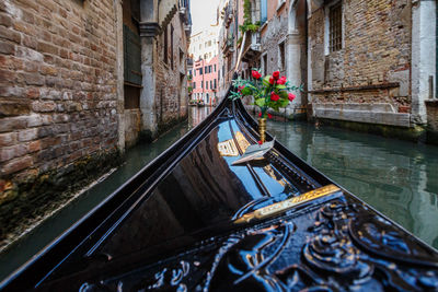 View of canal amidst buildings