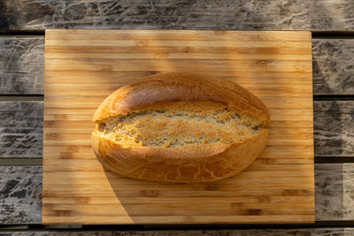 High angle view of bread on cutting board