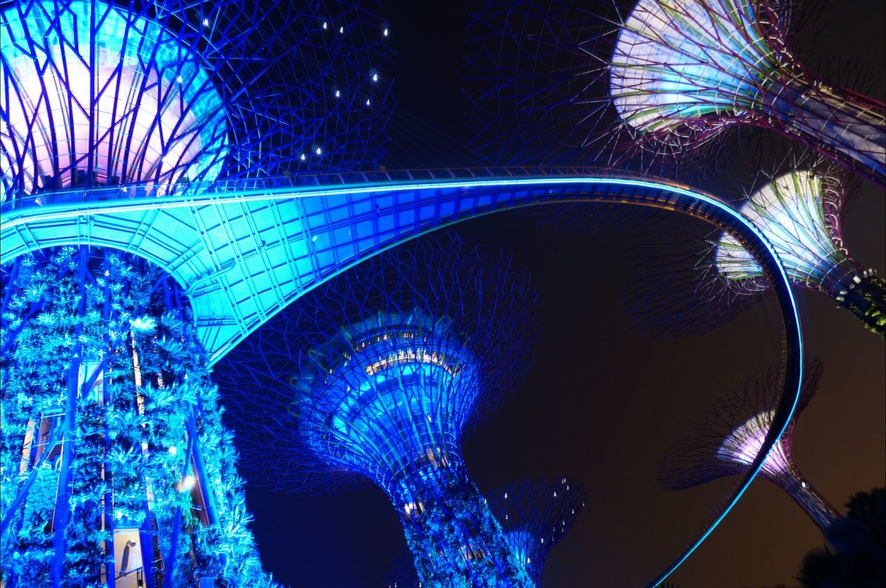 blue, arts culture and entertainment, night, illuminated, amusement park ride, amusement park, low angle view, pattern, long exposure, ferris wheel, outdoors, multi colored, motion, no people, spinning, close-up, peacock, sky, famous place, travel destinations