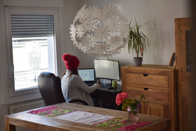 Young woman working from home in winter