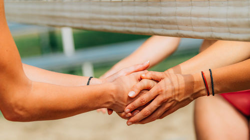 Beach volleyball girls shaking hands after the match