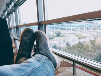 Relaxing in niks shoes at igi airport delhi shoes towards city from windows