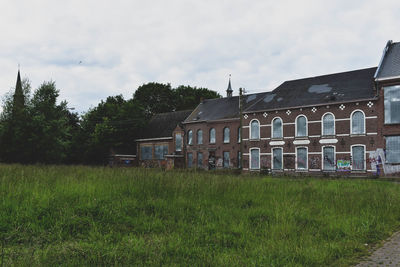 House on field against sky