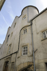 Low angle view of old building against sky