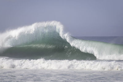 Waves splashing on rocks