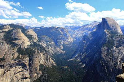 Scenic view of mountains against cloudy sky