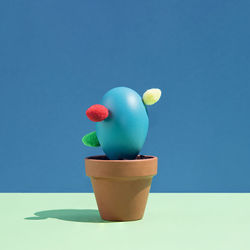 Close-up of potted plant against blue background