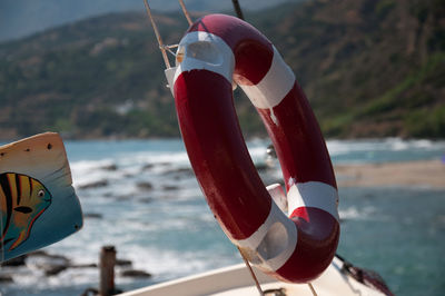 Close-up of coin-operated binoculars by sea