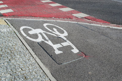 High angle view of arrow symbol on road