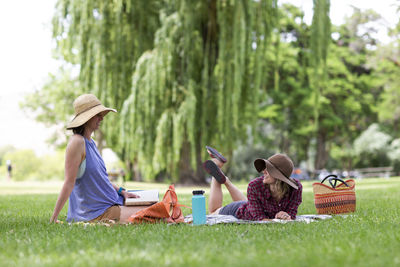 Two women enjoy a park on a sunny day in the columbia gorge.