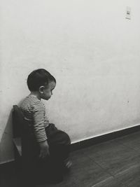 Woman standing on wall