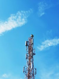 Low angle view of communications tower against sky