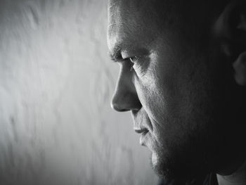 Close-up of thoughtful mature man looking away