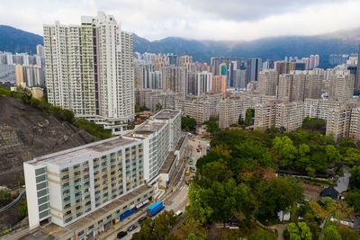 High angle view of buildings in city against sky