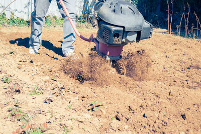 Low section of man working at construction site