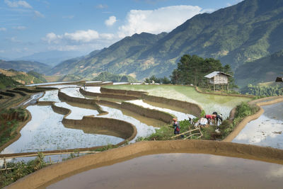 High angle view of agricultural landscape against sky