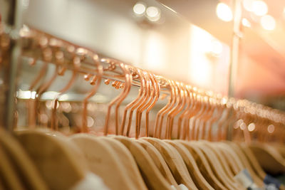 Row of clothes hanging on display at store