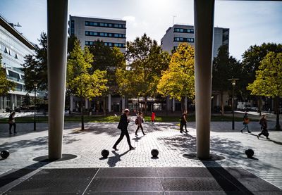 People walking on street in city