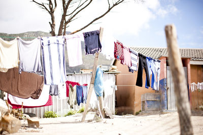 Clothes drying on house roof