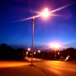 Street light against sky at night