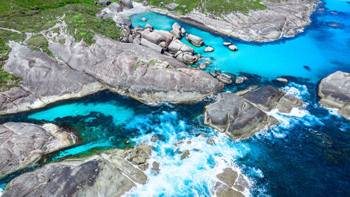 Aerial image of elephant rocks and green pools in denmark, western australia.