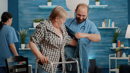 Doctor helping patient at hospital